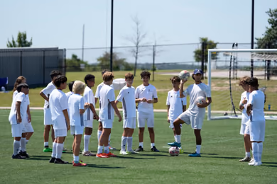 Fundación Real Madrid soccer camp training session on the field