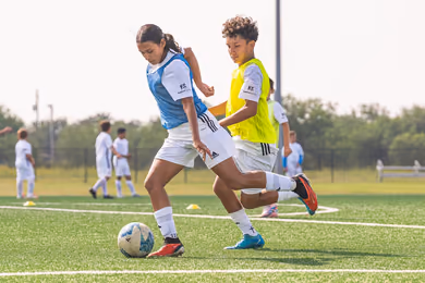 Young players developing soccer skills during a Fundación Real Madrid camp in Kitchener
